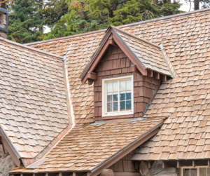 The installation of wood shingles or shakes for a new roof is a mid range roofing option.